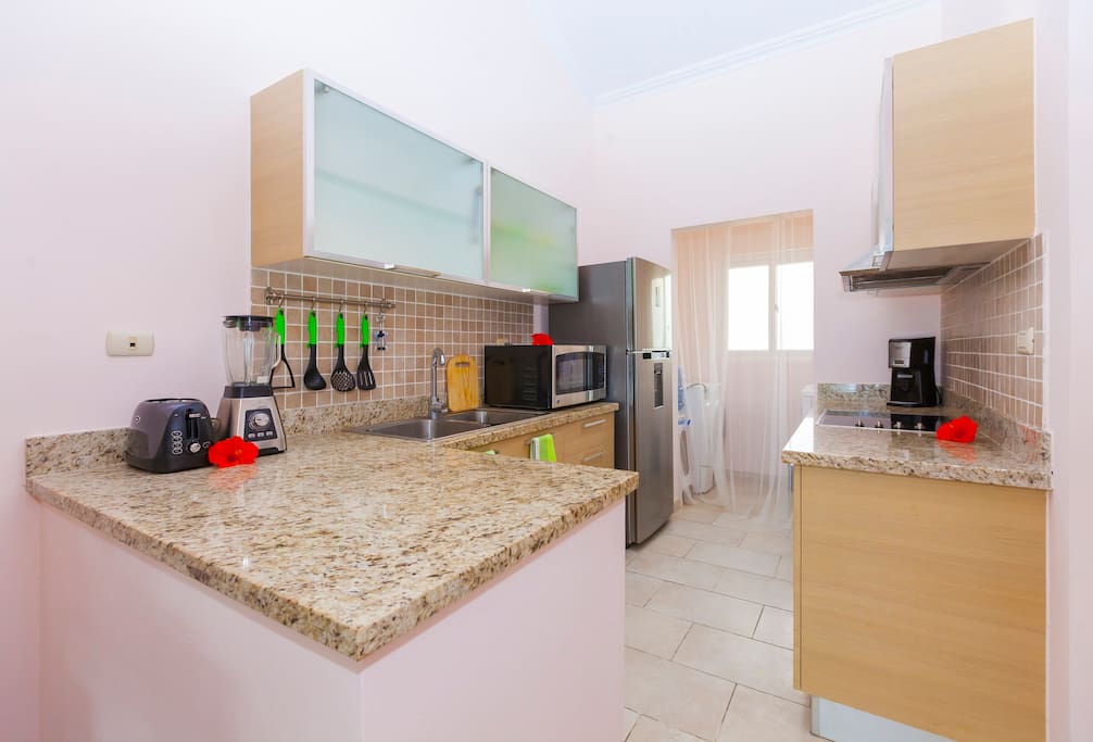 Premium kitchen appliances. You will find all necessary utensils here, such as bowls, glasses, plates, pots and pans.