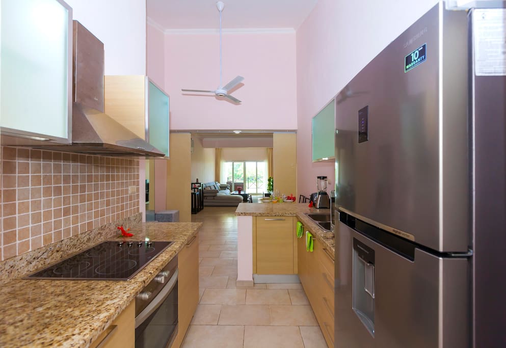 Kitchen appliances. Full size fridge with water cooler. Always cool water and fresh products.