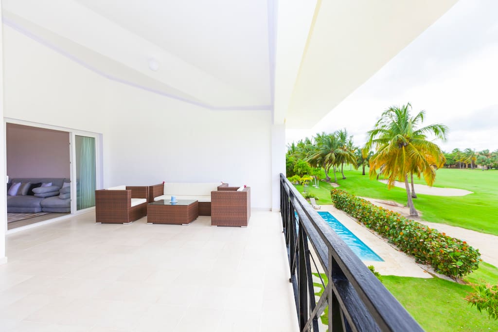 Huge, fully furnished balcony overlooking the golf course and the swimming pool. Take a look from the balcony and enjoy your stay here!