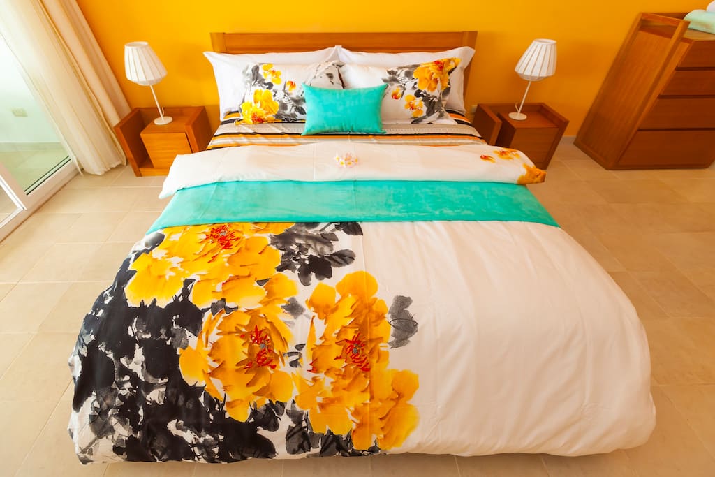 Master bedroom (orange). Premium bed for sweet mornings and peaceful dreams