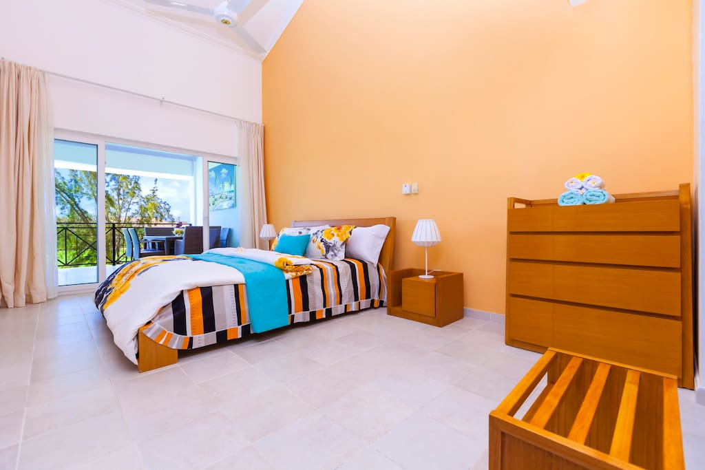 Master bedroom (Orange). Even from your bedroom, you'll have an amazing view. Just wake up, open the curtains and enjoy it. You have all the furniture to store your clothes and personal things in!