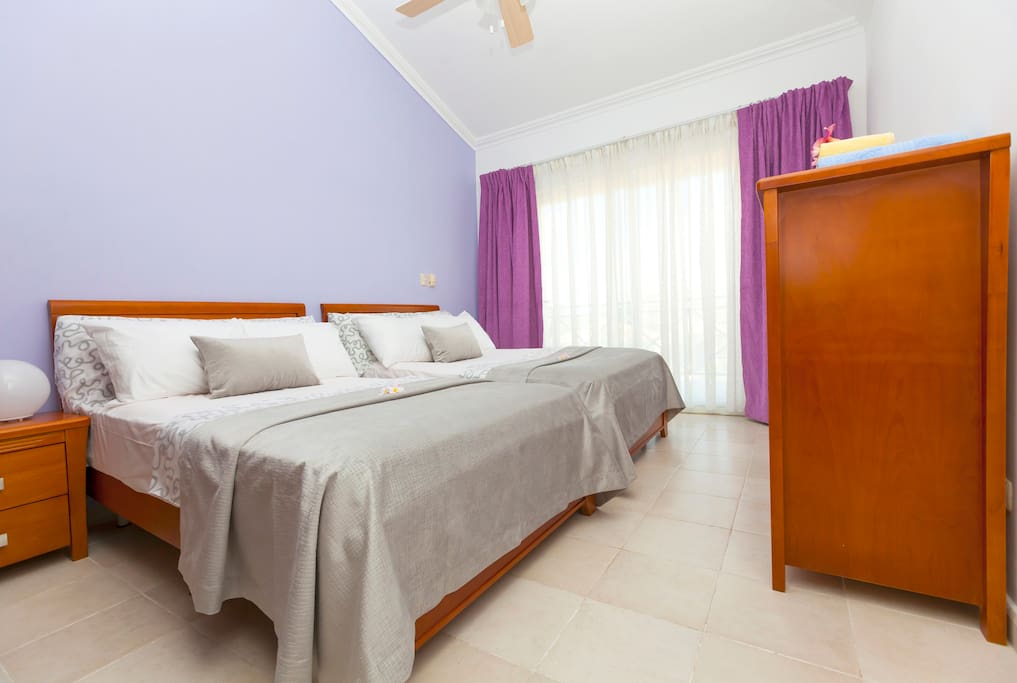 Second bedroom (lilac). Air conditioner and ceiling fan will make your stay comfortable