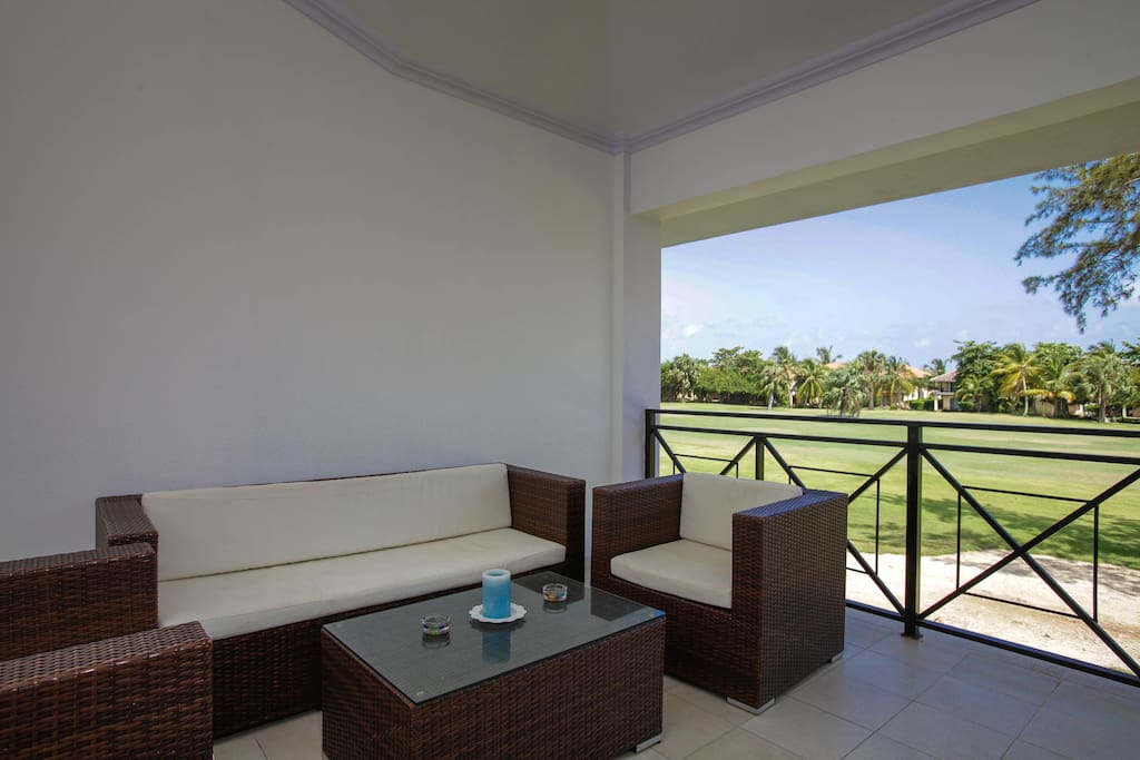 Comfortable settee on your huge balcony - nice place to admire the Dominican nature. On one side, there is an outdoor settee with 2 armchairs, and on the opposite side, there is a dining table.