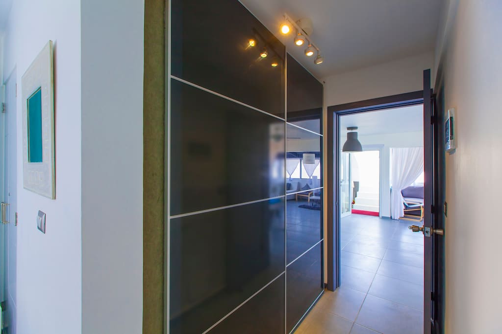 The corridor leads to the living room, where you'll have a royal vacation. The place is fantastic and will match your expectations.