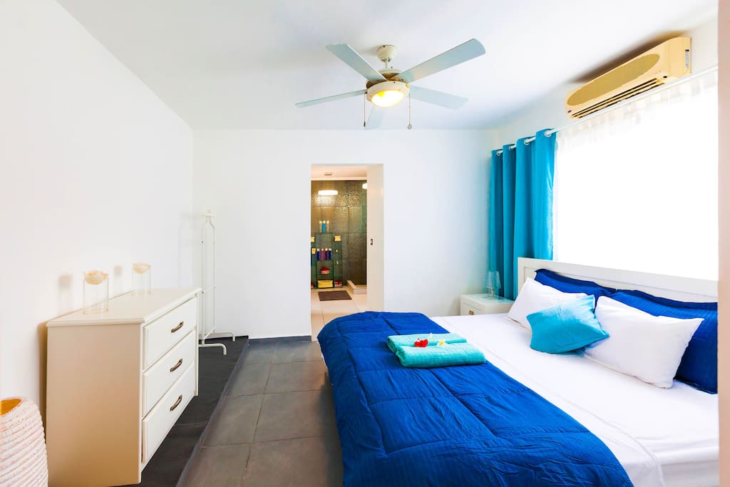 Spacious, fresh, lovely designed room with a comfortable big bed. Fresh linen. A kit of Fresh towels. So you can sleep well and enjoy your stay. The bedroom has a spacious closet so you can store your things. Lamps, ceiling fan, and air conditioner will make your stay comfortable and enjoyable