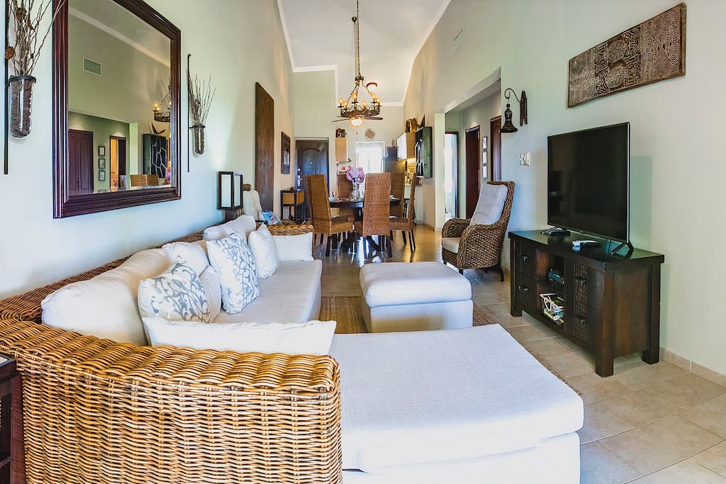 Spend your time here sipping your coffee: you'll feel very comfortable sitting on this sofa and watching a nice movie with your family. The room has a lot of space for everyone