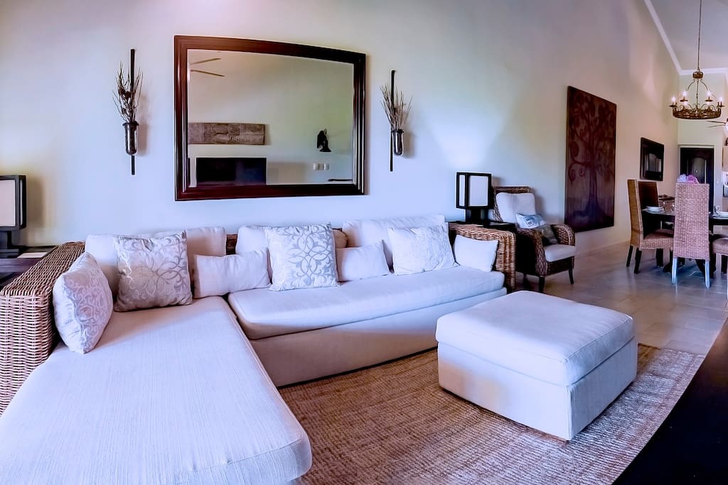 Look how big this sectional is: soft pillows and the entertainment center will bring comfort and peace to your stay here! Book your vacation today!