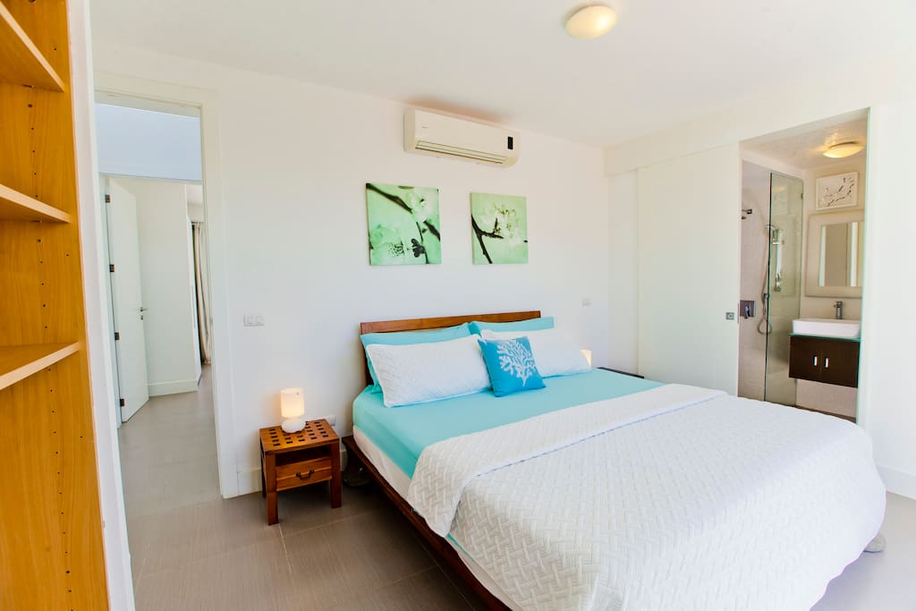 The bedroom features a big SUPER cozy bed for royal sleep, spacious wardrobe and air conditioner.