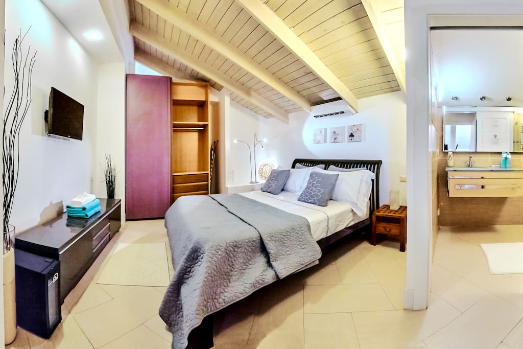 In the bedroom you'll have a big SUPER cozy bed, a big spacious wardrobe, air conditioner and en-suite bathroom with basic amenities.