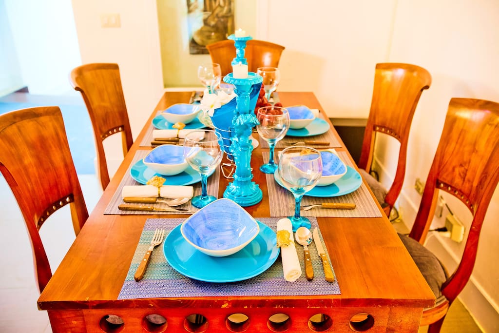 Wooden dining table for 6 persons. Tableware & cutlery provided.