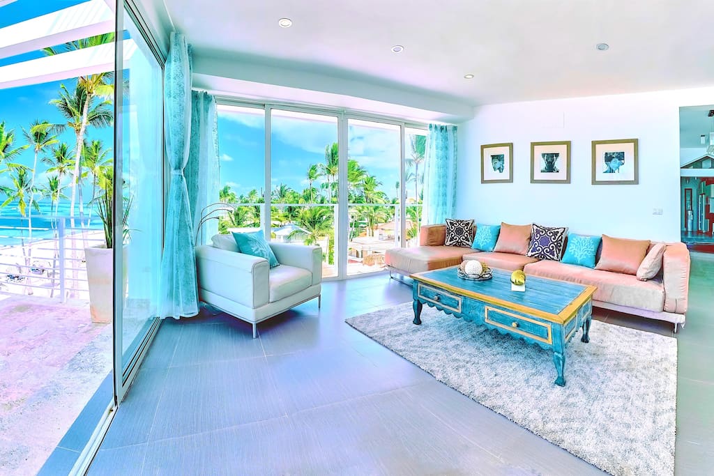 Cosy living room is full of natural light and ocean breeze.
