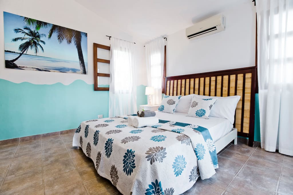 Super cozy and big bed is for your comfort. The room is very spacious and features a TV and a wardrobe.