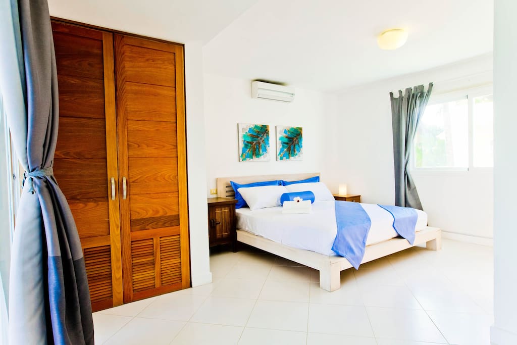 Feel at home in the bedroom with a big wardrobe, air conditioner and en-suite bathroom.