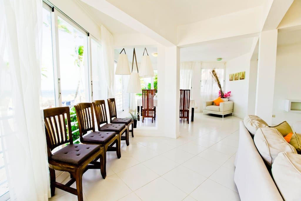The living room is always full of sunlight and sea breeze because it is a really beachfront accommodation.