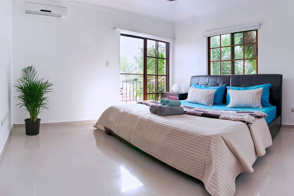 Bright modern bedroom full of natural light.