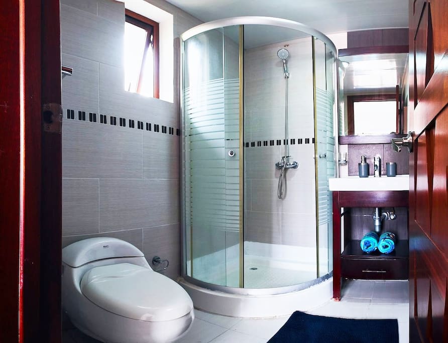 Clean bathrooms with a set of fresh towels, soap and other essentials.