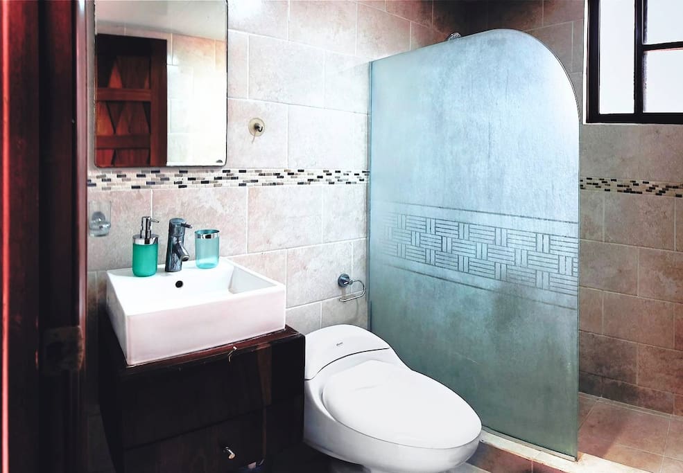 The bathrooms are equipped with towels and other essentials.