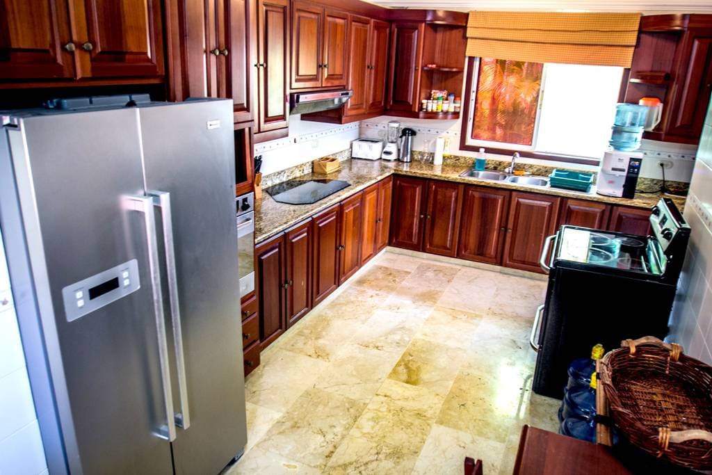 Enjoy cooking in this kitchen. It is fully equipped with modern furniture and kitchen appliances: fridge, oven, stove, microwave, coffee-maker, water cooler.