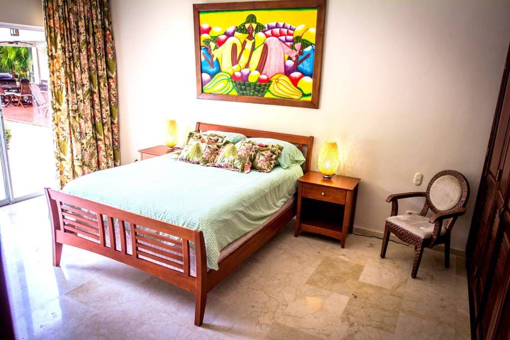 YOU can see that all the rooms are very well-equipped. This spacious bedroom has a big wardrobe, air conditioner, nightstands with lamps, cozy armchair. Book it now!
