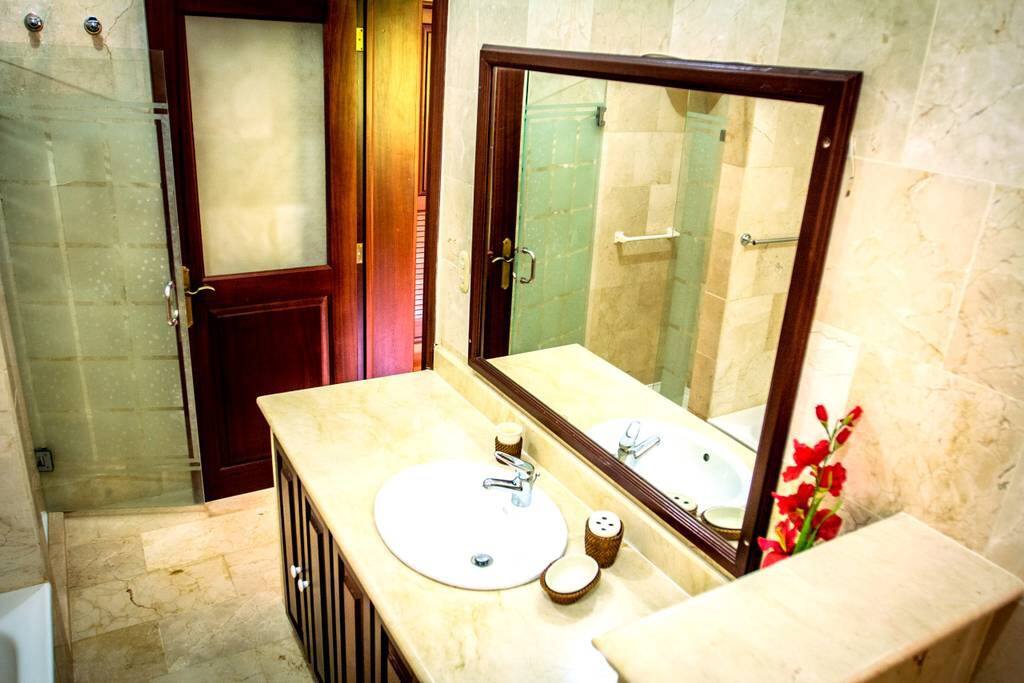 Start the day in your private bathroom with a large mirror!