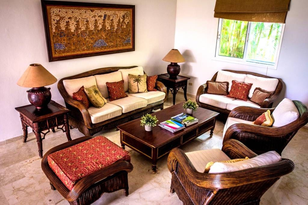 You will feel right at home in this cozy living room with premium wooden furniture.