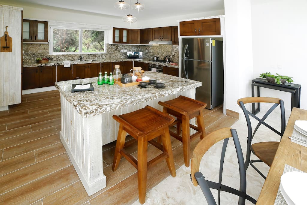 A spacious kitchen is a good place for cooking the most delicious meals.