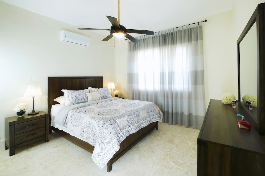 The bedrooms have air conditioning and large beds with fresh linens.