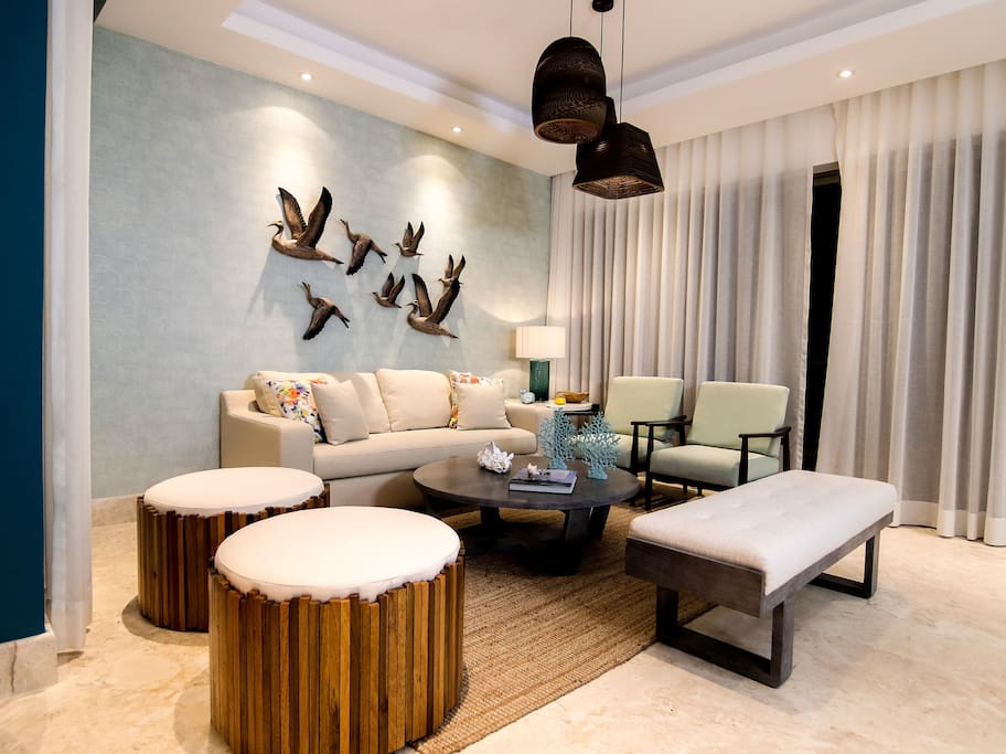 Look at this spacious living zone. What is it about opening a bottle of wine and sharing it with friends?