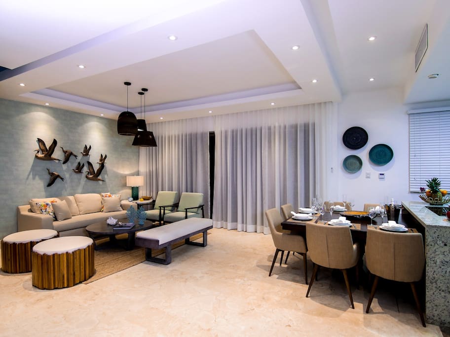 Gorgeous modern living room wih a dining zone. There's enough room for everyone!