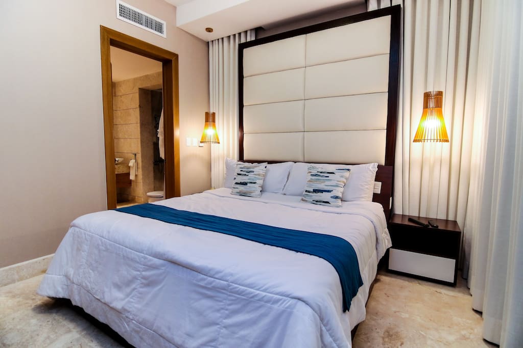 Cozy bedroom with a comfortable bed with fresh linen, pretty textiles and en-suite bathroom for your maximum comfort!