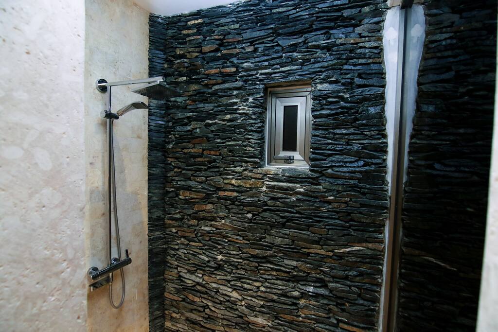 Look at this chic decor! The bathroom has rain shower and luxury toiletries