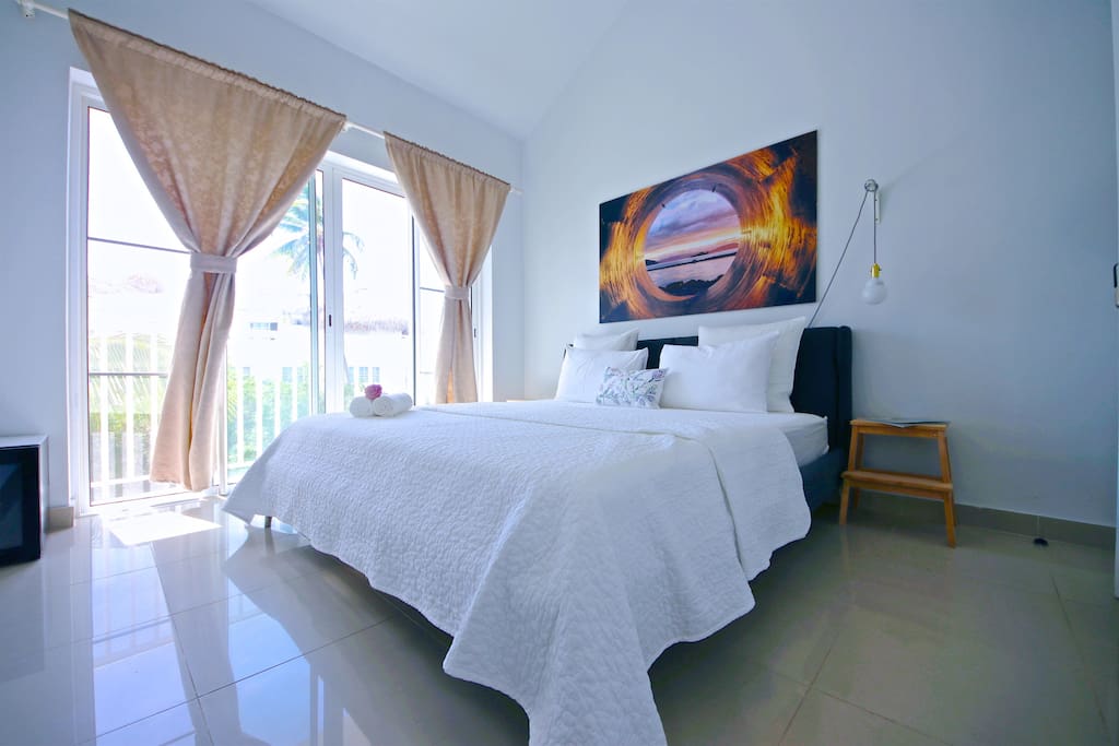 This large soft bed with fresh linen will let you get a deep healthy sleep and sweet dreams