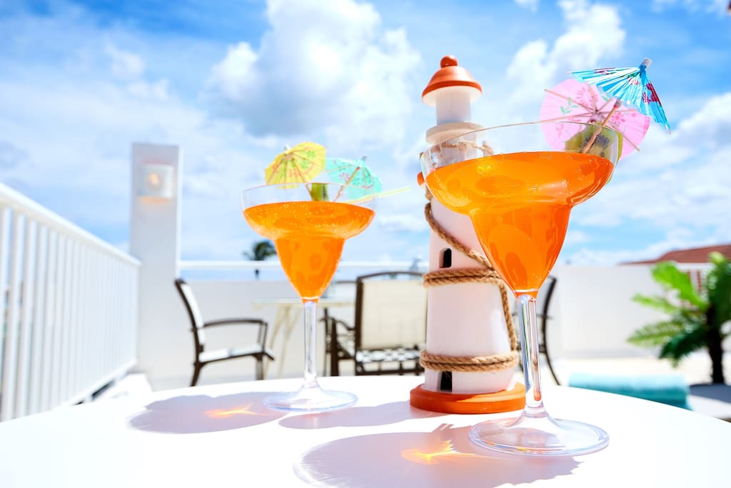 A pleasant conversation drinking an exotic cocktail on the open terrace and admiring the wonderful sunset - the perfect end of the day