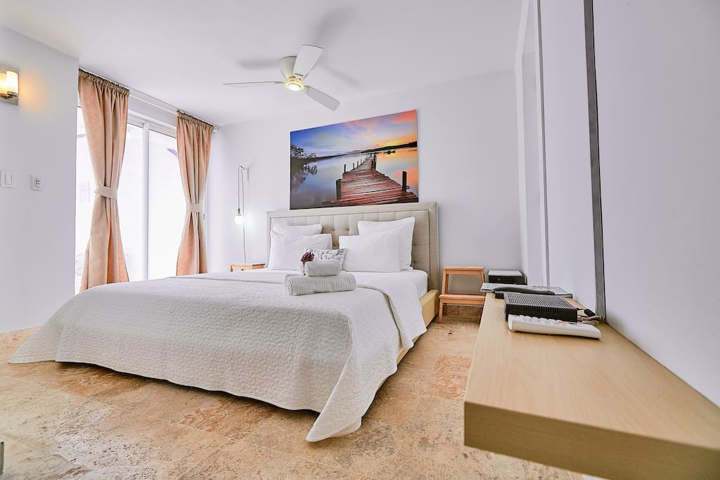 A bright bedroom with a comfy double bed for your sweet dreams.