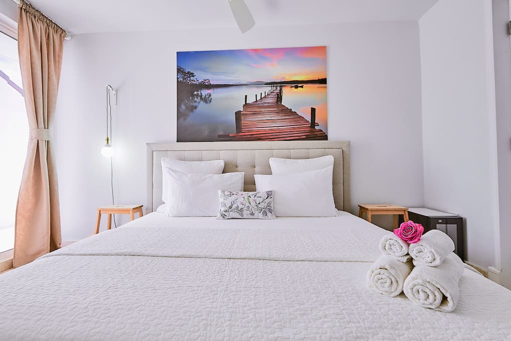 A bright bedroom with a comfy double bed for your sweet dreams
