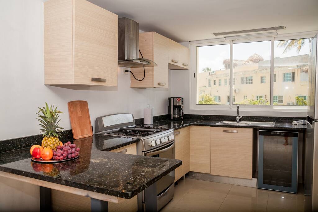 Just take a look at this kitchen. Fresh and modern. You can cook your breakfast here. And enjoy your coffee.