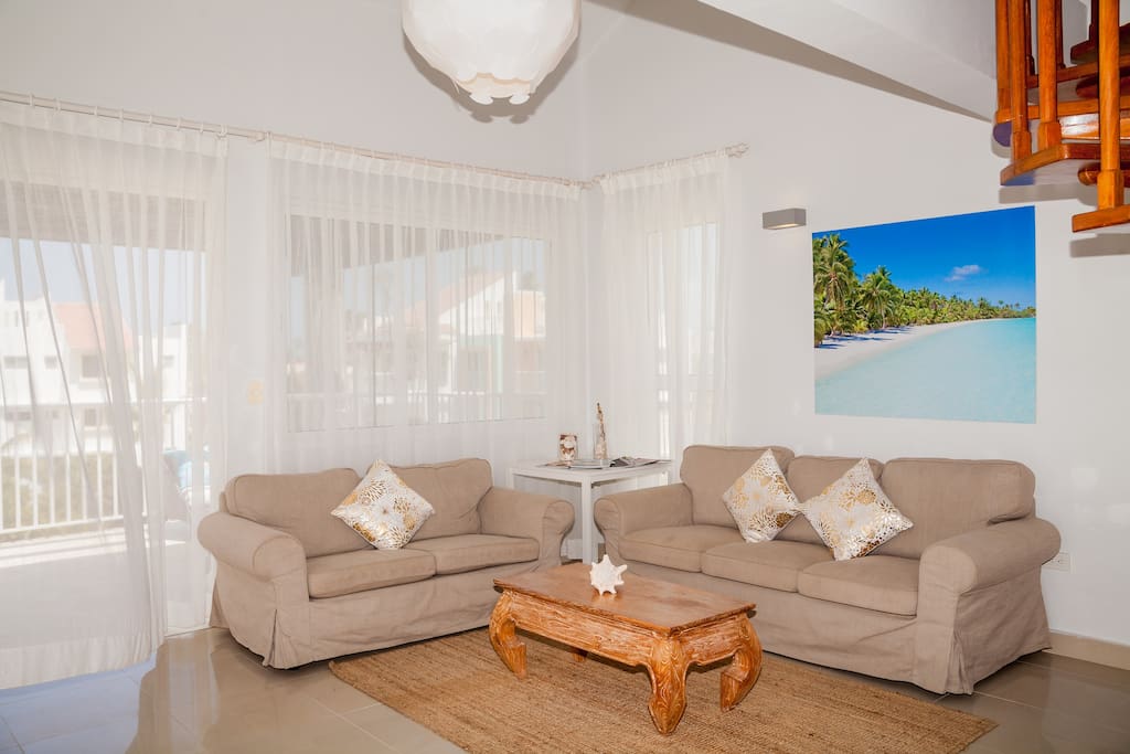 Sit here and watch TV enjoying your mojito or juice. The furniture is new and comfortable.