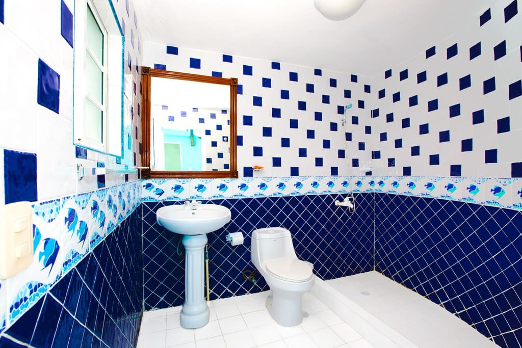 A full, standalone bathroom. Nearby the BBQ area and the party deck.